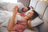 Couple lying on a couch in a cozy room